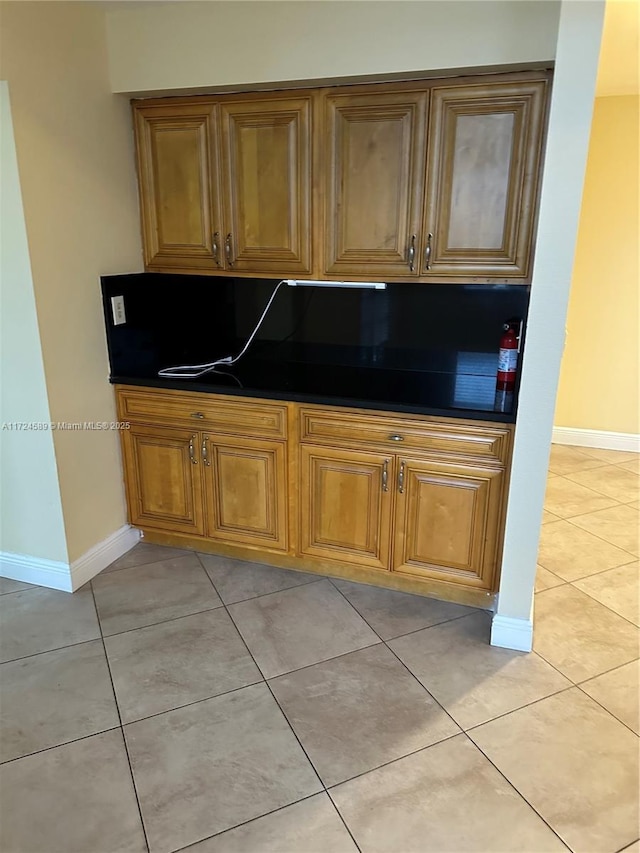 kitchen with light tile patterned flooring