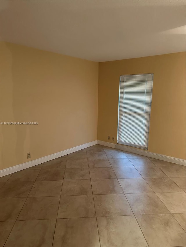 view of tiled spare room