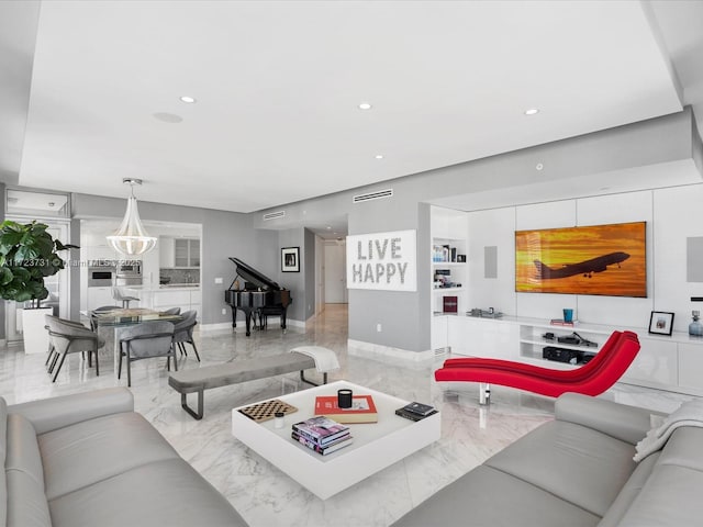 living room featuring a chandelier