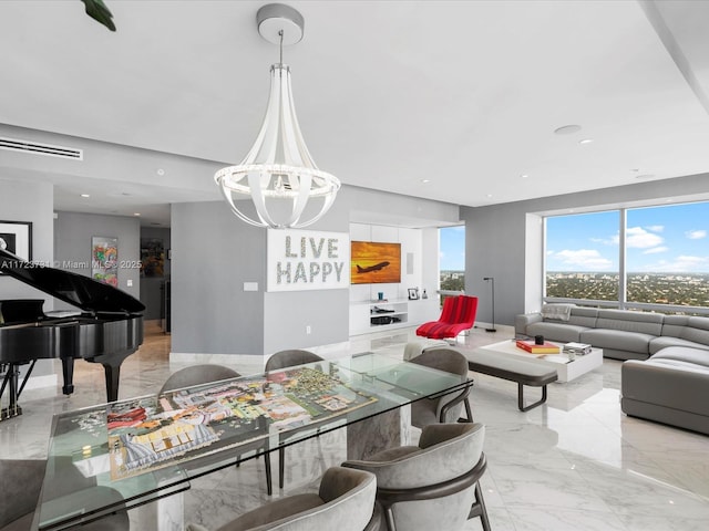 dining area with an inviting chandelier