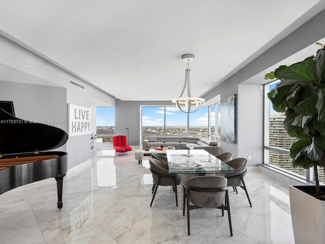 dining space featuring a notable chandelier