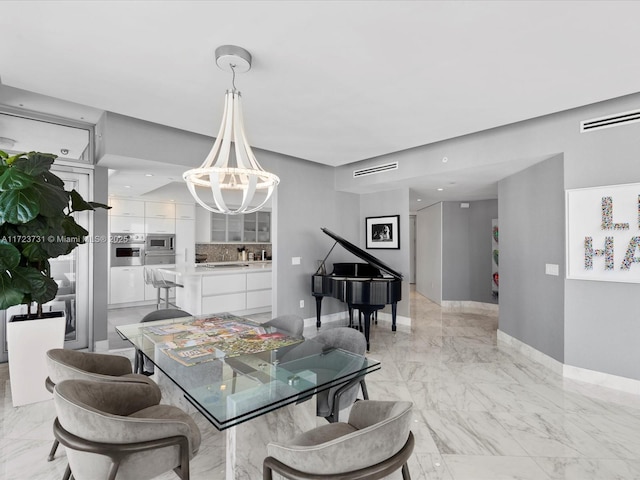 dining area with a notable chandelier