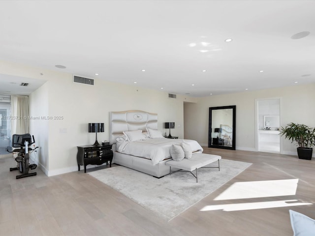 bedroom with light hardwood / wood-style floors