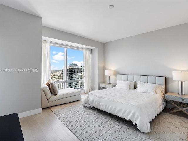 bedroom with light hardwood / wood-style flooring