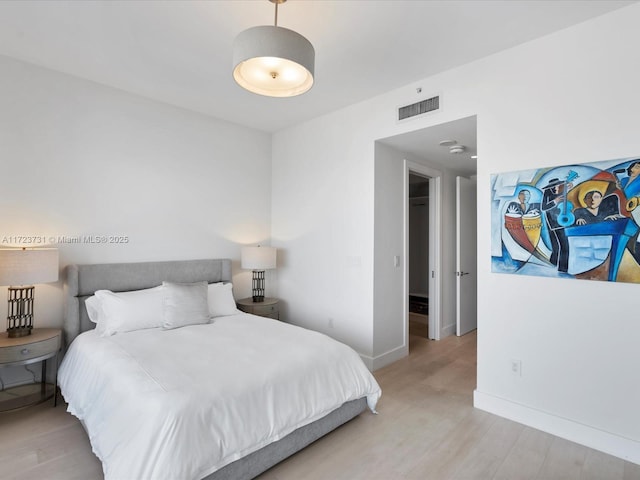 bedroom featuring light hardwood / wood-style floors