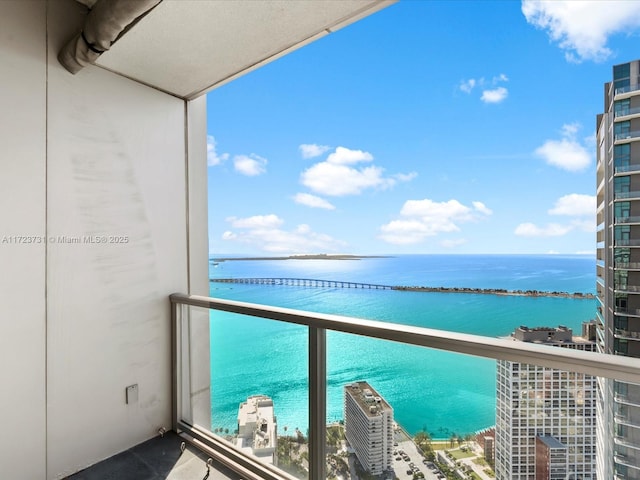 balcony featuring a water view