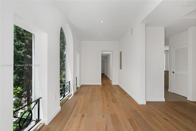 hall with light hardwood / wood-style floors