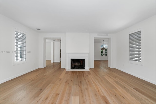 unfurnished living room featuring light wood-type flooring