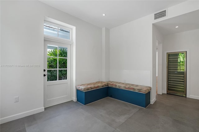 mudroom with concrete flooring