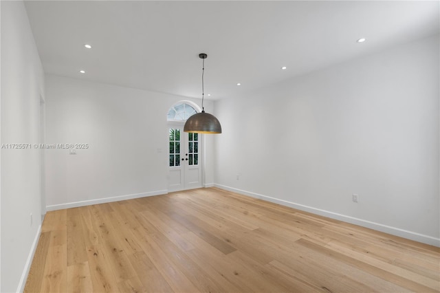 unfurnished room featuring light hardwood / wood-style flooring