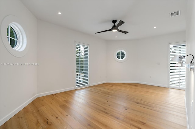 empty room with light hardwood / wood-style floors and ceiling fan