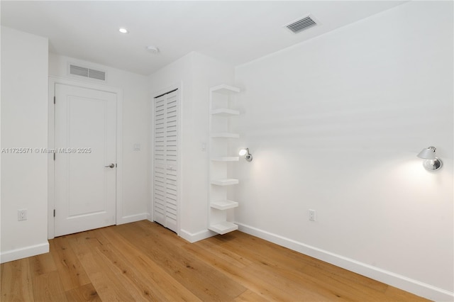 interior space with hardwood / wood-style floors