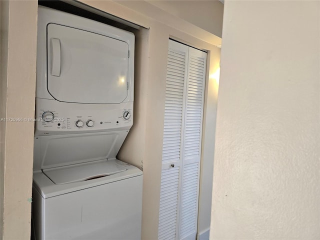 laundry room featuring stacked washer and dryer