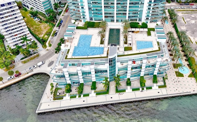 bird's eye view featuring a water view and a city view