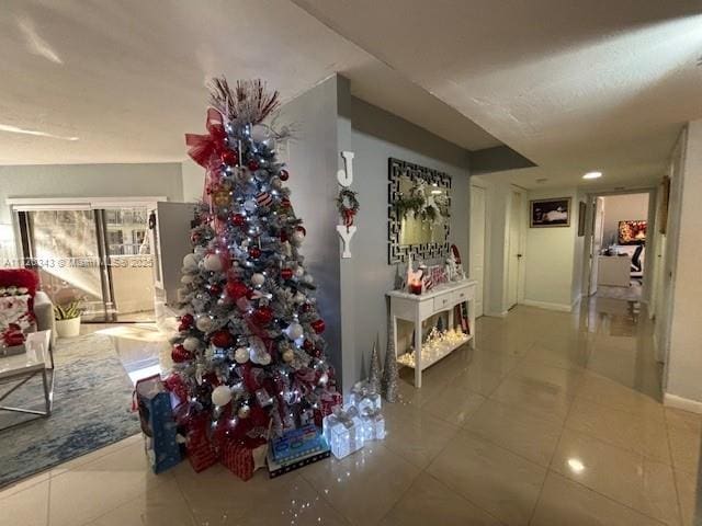 hallway featuring tile patterned flooring