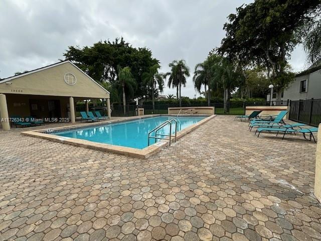 view of swimming pool with a patio