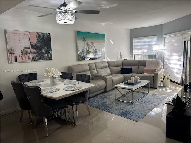 living room with ceiling fan and tile patterned floors