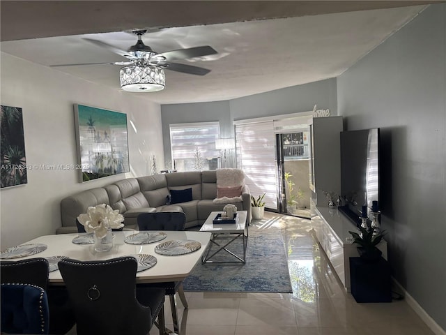 tiled living room with ceiling fan