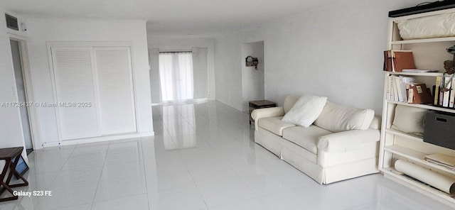 living room with light tile patterned floors