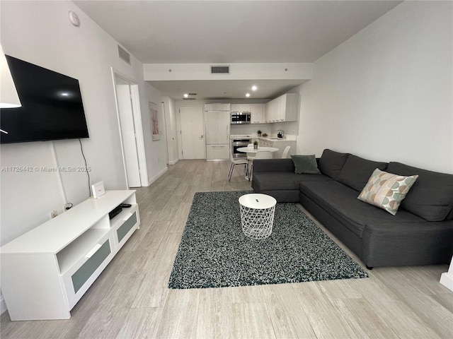 living room featuring light wood-type flooring