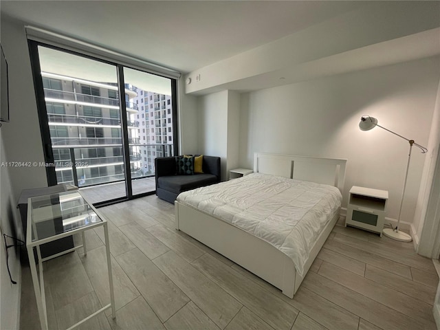 bedroom featuring expansive windows