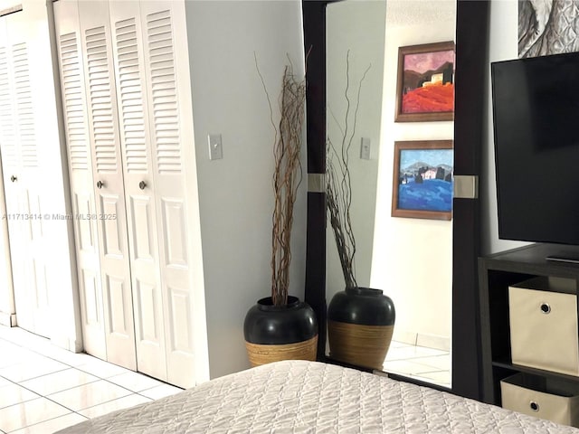 bedroom with light tile patterned floors