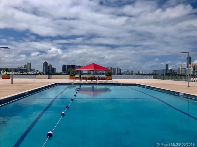 view of swimming pool featuring a gazebo