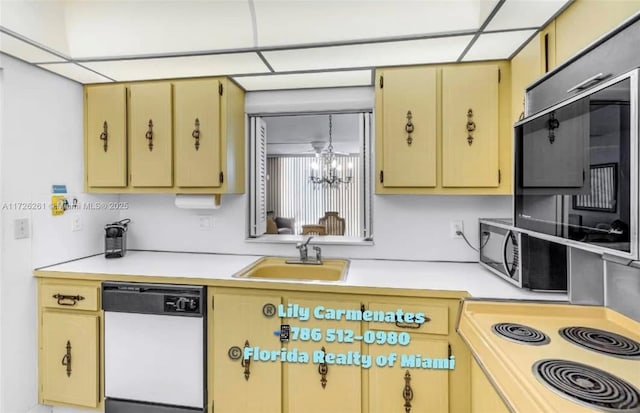 kitchen featuring sink, a chandelier, electric range oven, dishwasher, and a drop ceiling