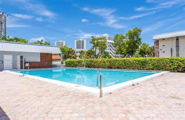 view of swimming pool featuring a patio