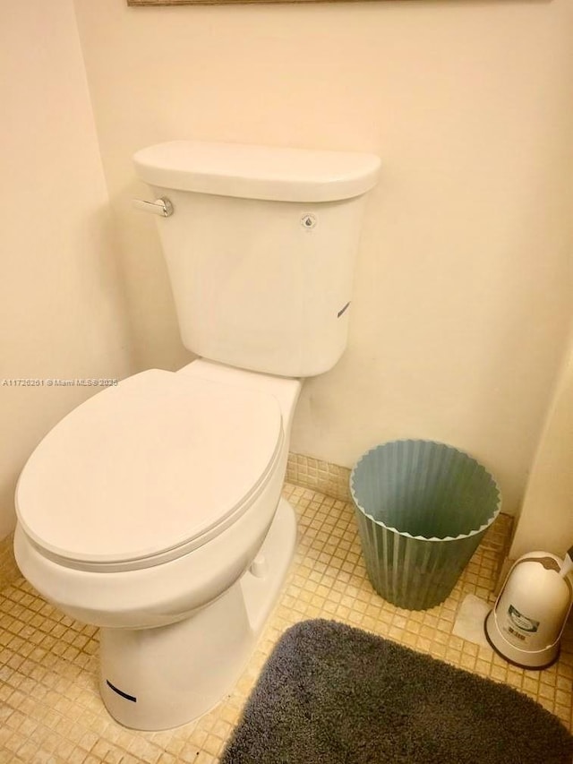 bathroom with tile patterned floors and toilet