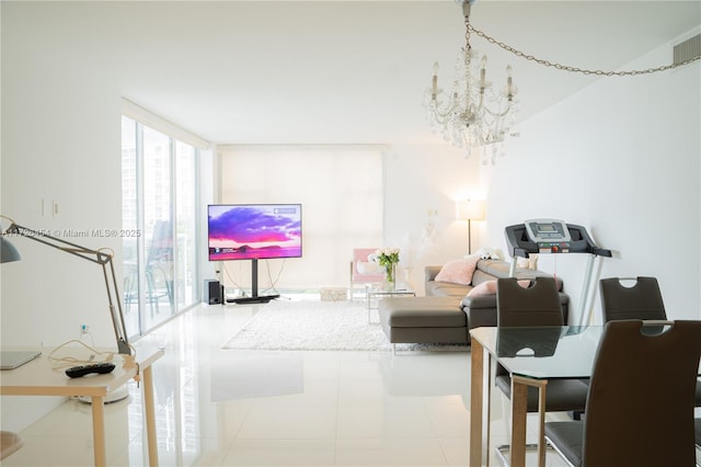 tiled living room featuring a notable chandelier and expansive windows