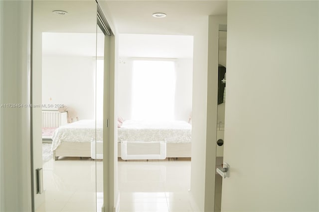 corridor featuring light tile patterned flooring