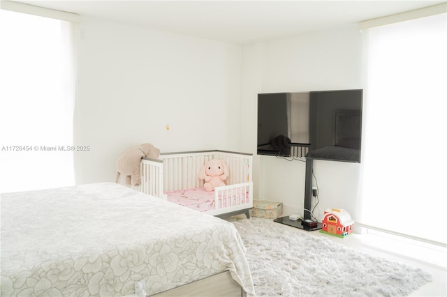 bedroom featuring multiple windows