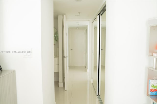 hallway with light tile patterned floors