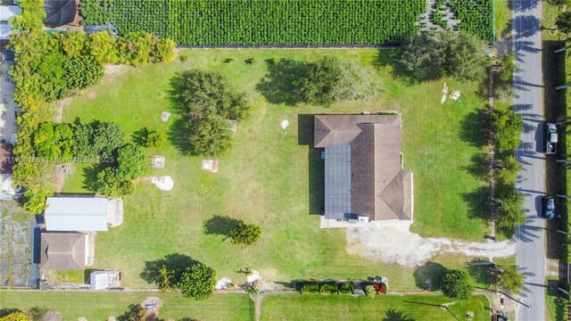 birds eye view of property with a rural view