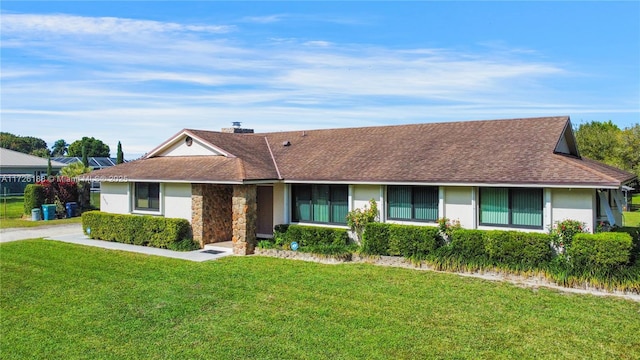 ranch-style home with a front yard