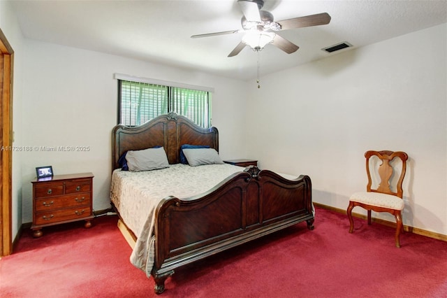 bedroom with dark carpet and ceiling fan