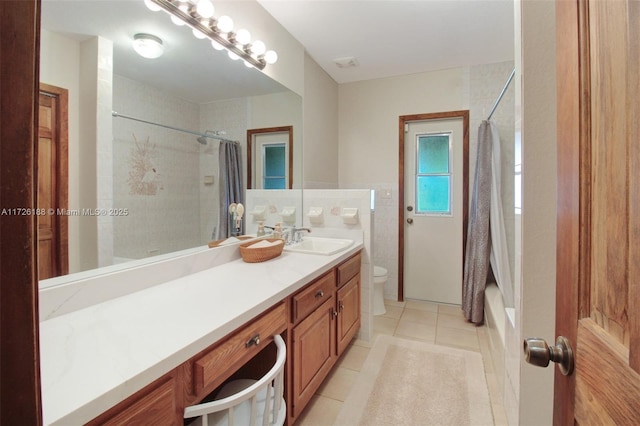 full bathroom with shower / bath combination with curtain, vanity, toilet, and tile patterned flooring