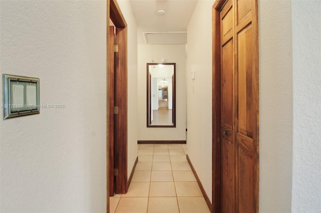 hallway featuring light tile patterned floors