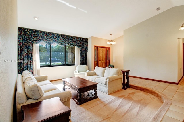 tiled living room with lofted ceiling and an inviting chandelier