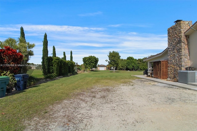 view of yard with central AC