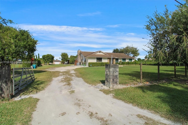 view of front of house with a garage and a front lawn