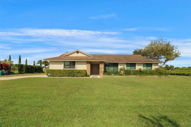 ranch-style house with a front yard