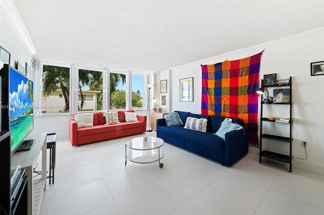 tiled living room featuring a textured ceiling and ornamental molding