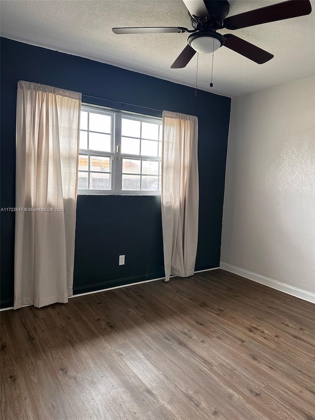 unfurnished room featuring a textured ceiling, ceiling fan, and hardwood / wood-style floors