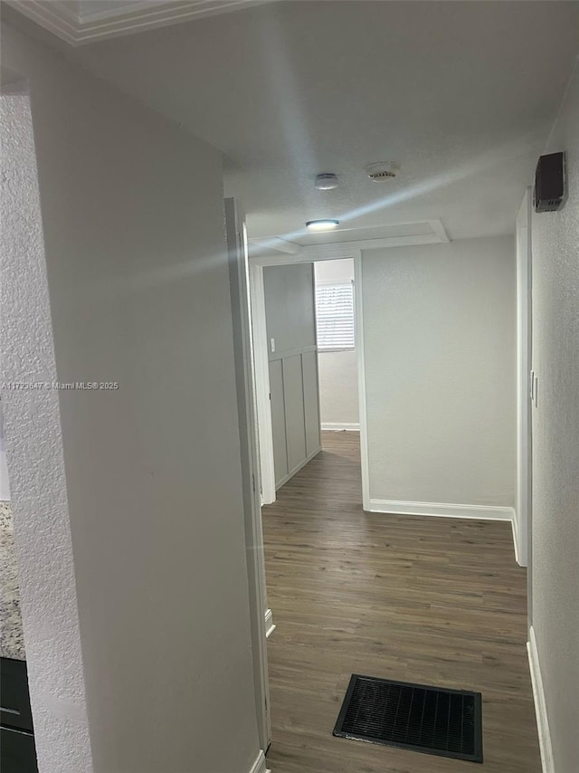 hallway with dark hardwood / wood-style floors