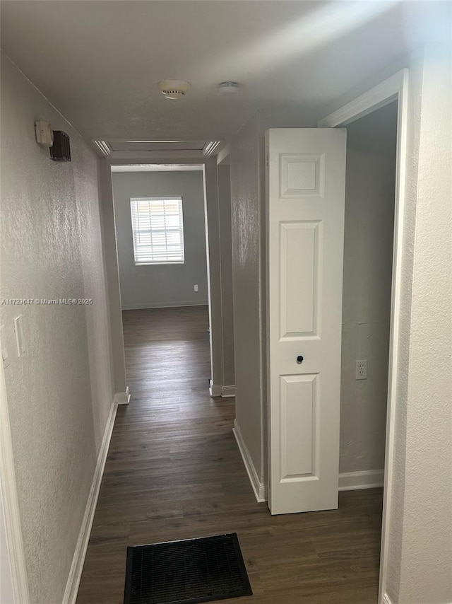 hall featuring dark wood-type flooring