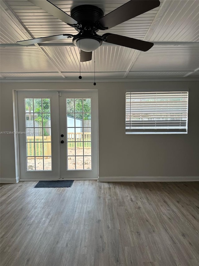 spare room featuring ceiling fan, french doors, and hardwood / wood-style floors