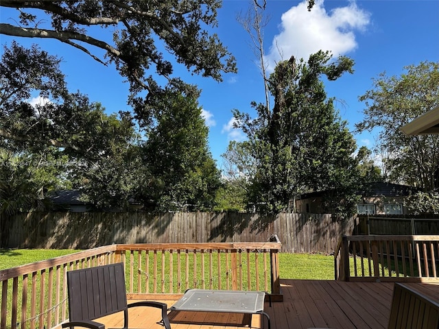 wooden deck with a yard