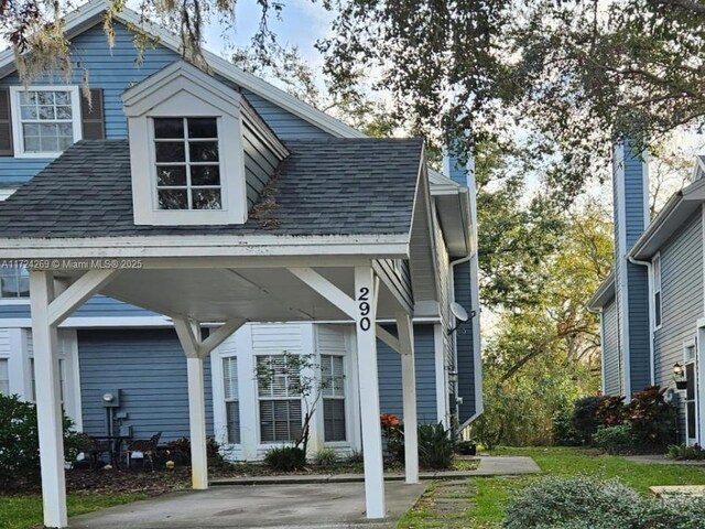 view of front of home featuring a carport